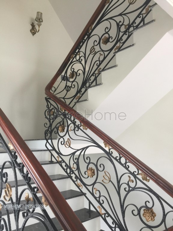 Thi công cầu thang sắt tay vịn gỗ